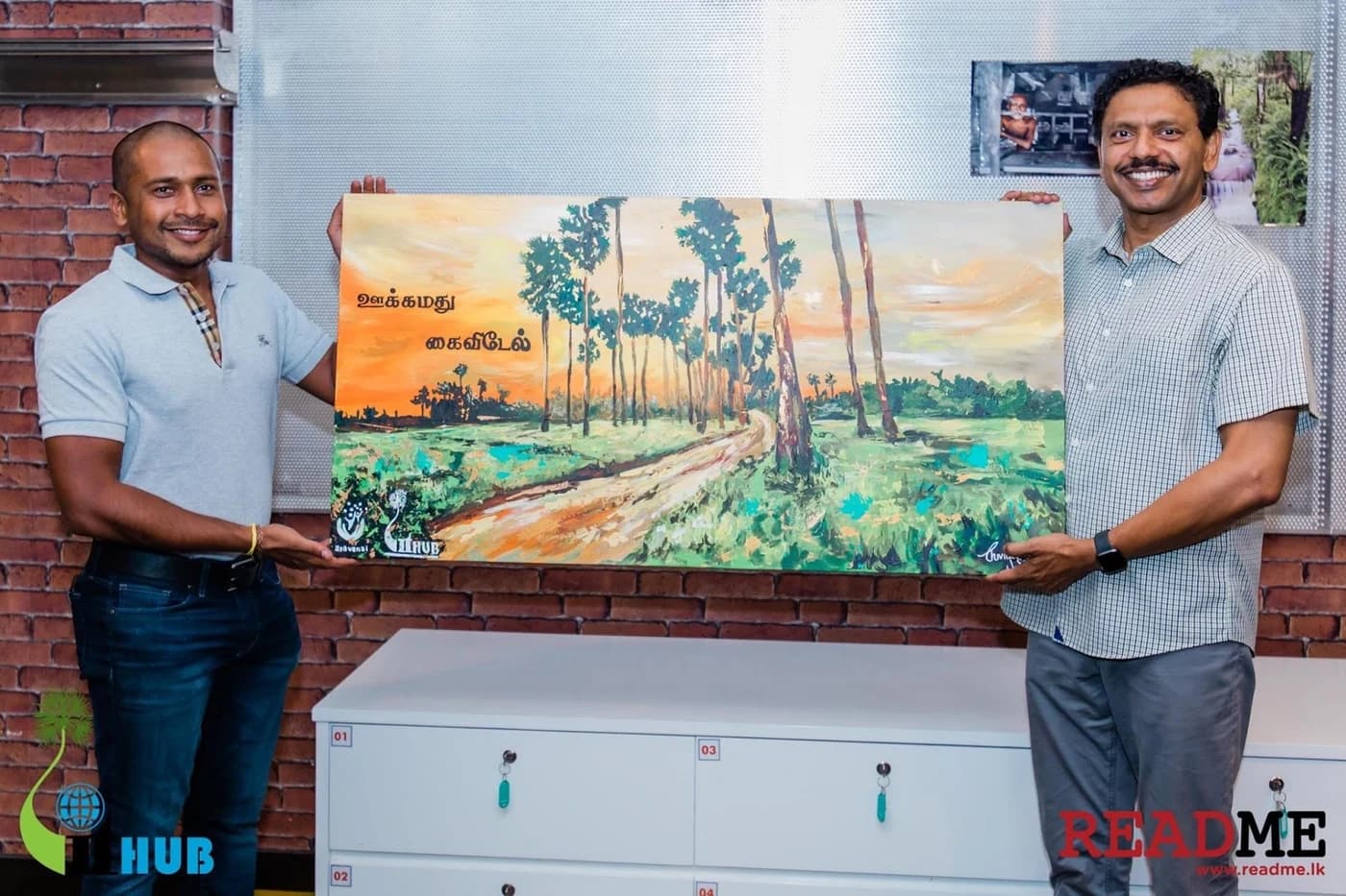 Aravanai community members holding artwork