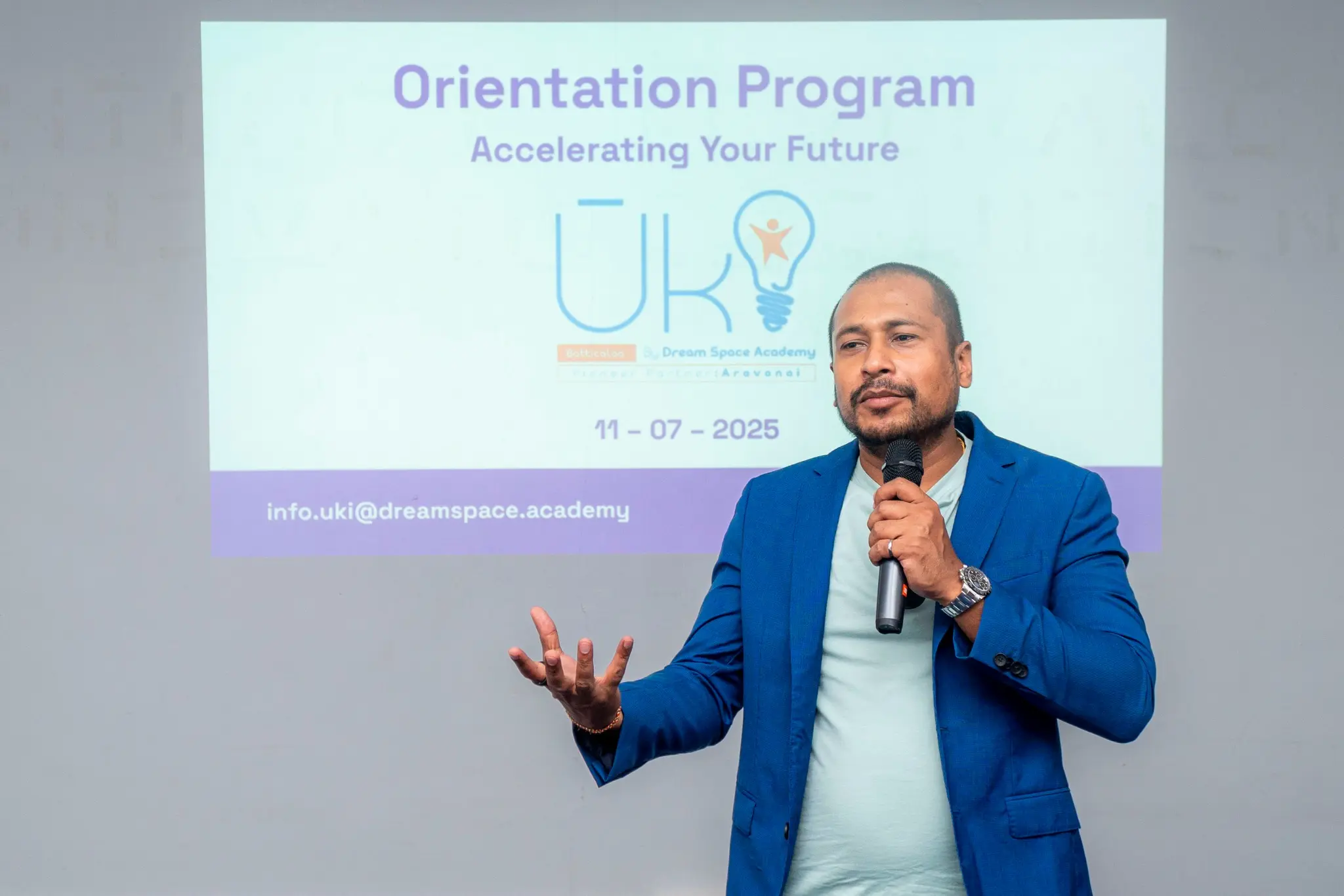 Speaker presenting at a UKI Batticaloa orientation program